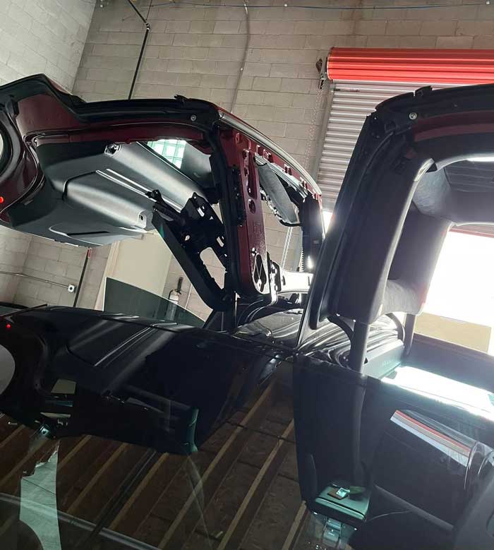 Tesla Model X falcon-wing door and glass service inside the Las Vegas shop